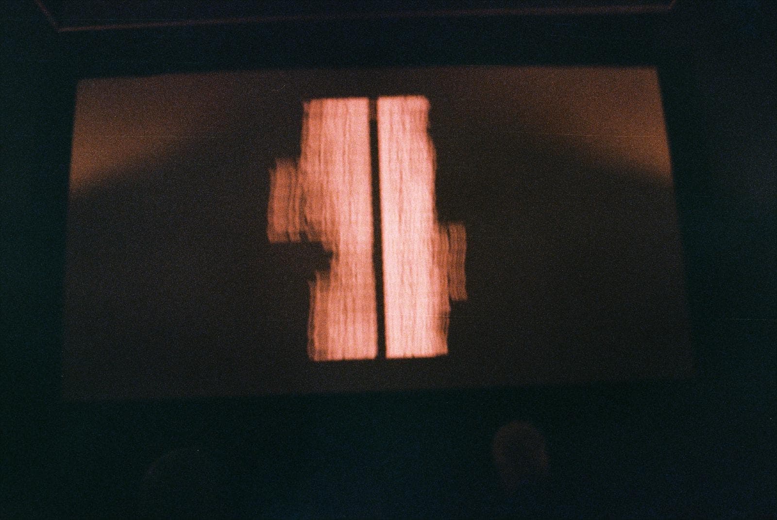 Glowing projection on a screen in a dark room